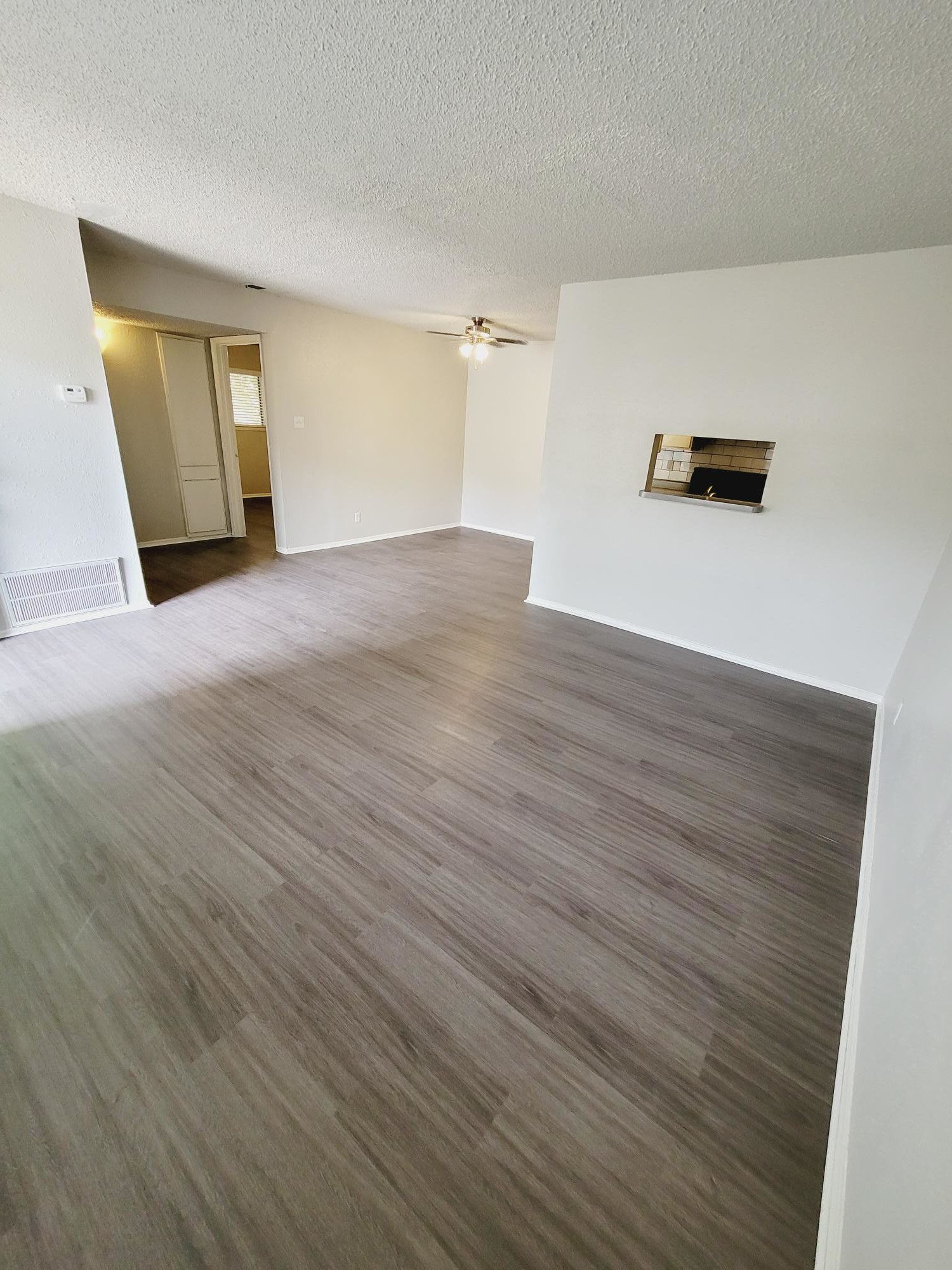 Abode Apartments - 805sqft, 1 Bed 2 Bath - Living Room and Kitchen