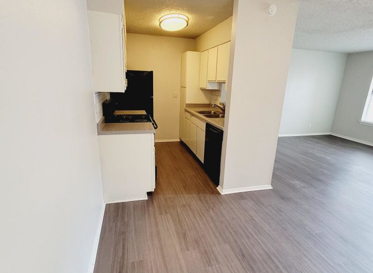 Abode Apartments - 805sqft, 1 Bed 2 Bath - Kitchen and Living Room